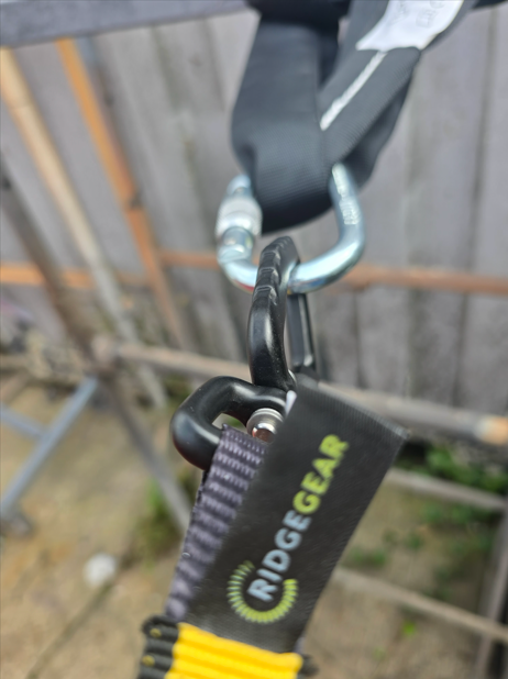 tool lanyard anchored on guardrail