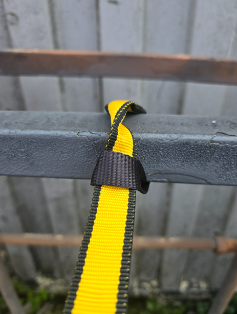 tool lanyard connected to guardrail
